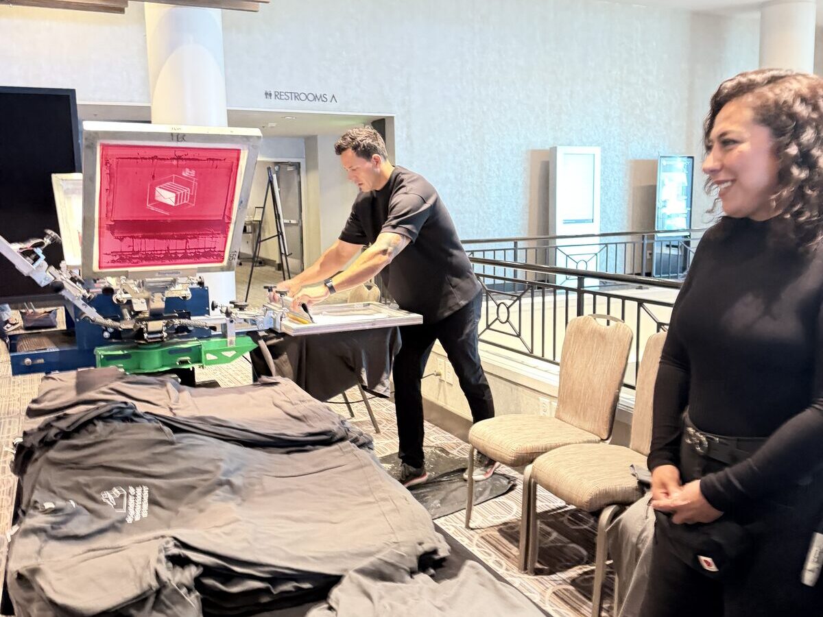Elegant live print station set up in an event atrium